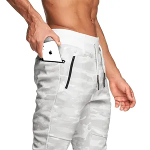 Close-up detail of men's white camo athletic joggers with functional zipper pocket