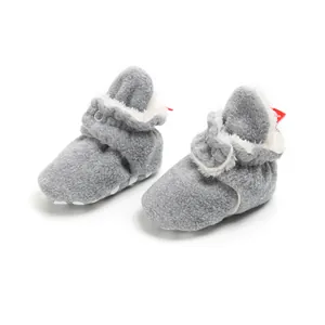 Soft grey winter baby booties with warm white fleece lining and non-slip soles