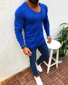 Close-up of a men's slim fit long sleeve knitted sweater in bright blue