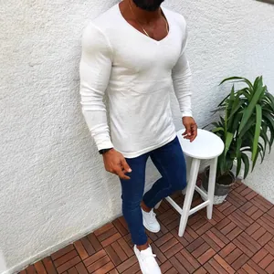 Slim fit white long sleeve V-neck knit sweater for men in casual outdoor setting