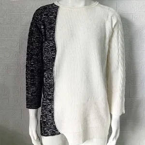 Detail of two-tone crew neck knit sweater with contrast black and white panels