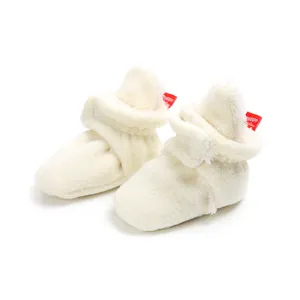 Cozy white fleece baby booties with soft soles for winter walkers, soft-top design.