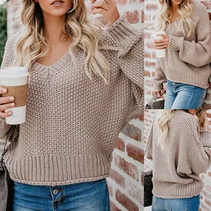 Oversized V-neck long sleeve knit sweater in beige for casual autumn and winter wear.