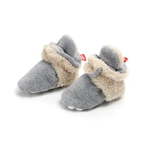 Cozy gray baby fleece booties featuring soft fluffy beige lining for winter warmth and foot comfort