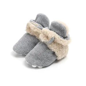 Cozy grey fleece baby booties with soft soles and warm faux fur lining detail