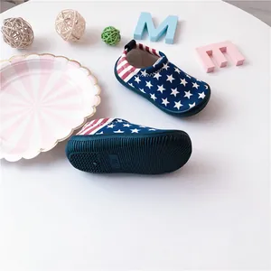 Close-up of children's slip-on shoes featuring American flag pattern and non-slip sole