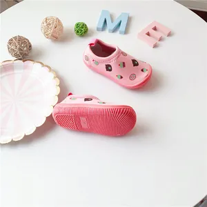 Pink toddler slip-on walking shoes with cute bear pattern and non-slip sole detail