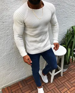 Detailed view of slim-fit men's white knitted sweater with shoulder ribbed texture