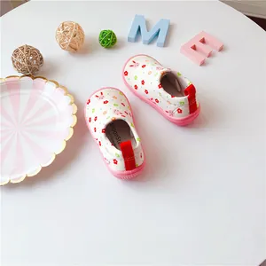 Detail view of MoonStar toddler walking shoes with floral and rabbit print pattern