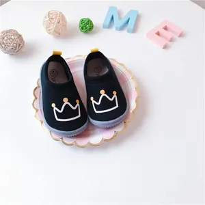 Black baby walking shoes with white crown print and easy slip-on elastic canvas design