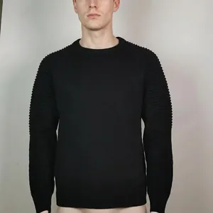 Close-up view of the unique pleated texture on the sleeves of a slim black men's knit sweater