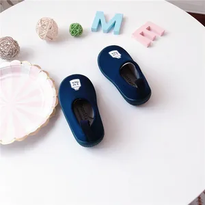 Top view of navy blue MoonStar kids canvas slip-on shoes with I love milk print.