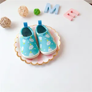 Detailed view of blue baby walking shoes featuring cloud and lightning patterns on canvas