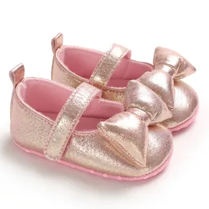 Elegant rose gold metallic baby princess walking shoes with large decorative bow detail