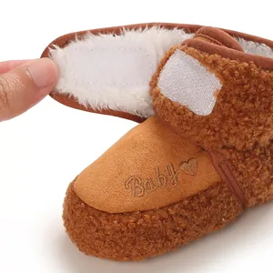 Detail of baby snow boot showing soft fleece lining and velcro closure