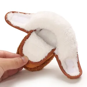 Close-up showing the soft white fleece lining and adjustable velcro on baby winter boots