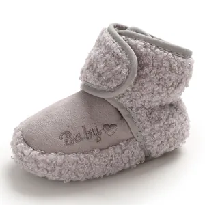Soft grey fleece-lined baby snow boots featuring an embroidered "Baby" text design.
