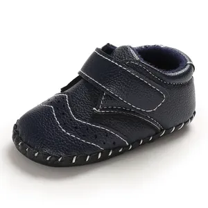 Close-up view of navy blue baby walker shoe with anti-slip sole and Velcro strap