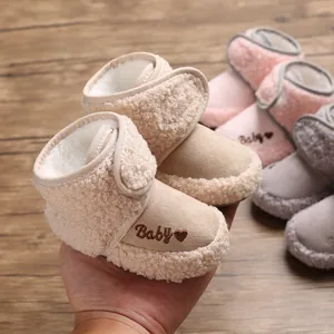 Detail view of cozy baby winter boots with soft fleece lining and heart embroidery