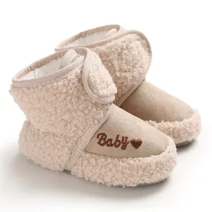 Detailed view of warm khaki sherpa baby winter boots featuring Baby heart embroidery