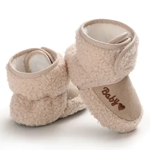 Cozy beige fleece baby snow boots with soft soles and embroidered heart for winter walking