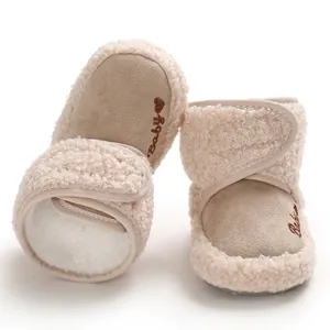 Detail view of warm baby winter snow boots with soft faux fur lining and velcro closure.