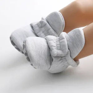 Comfortable soft grey infant sock shoes with non-slip soles for babies learning to walk