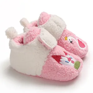 Close-up of soft pink fleece baby walking shoes with cute cartoon embroidery detail