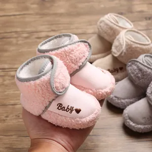 Warm pink baby snow boots featuring soft sherpa lining and 'Baby' embroidery detail