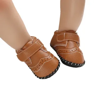 Brown leather baby walking shoes with non-slip rubber soles and Velcro straps