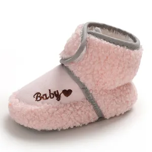 Detailed view of pink plush baby snow boot with embroidered Baby text and heart for infants