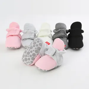 Soft cotton non-slip baby booties with adjustable straps shown in multiple colors