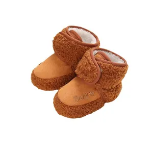Warm brown plush baby winter walking shoes with soft soles and 'Baby' embroidery
