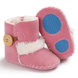 Pink baby snow boots with faux fur lining and anti-slip blue rubber sole detail