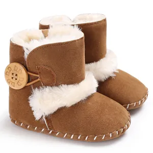 Close-up of brown baby snow boots with white faux fur lining and wooden button detail