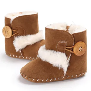 Cozy baby winter snow boots with white faux fur lining and decorative wooden buttons.
