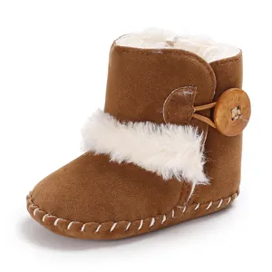 Warm baby snow boots for 0-1 year olds with white faux fur trim and button detail.