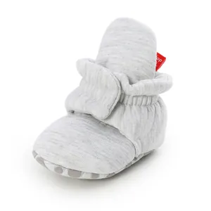 Close-up view of a grey heather baby walker shoe with soft non-slip sole and strap closure