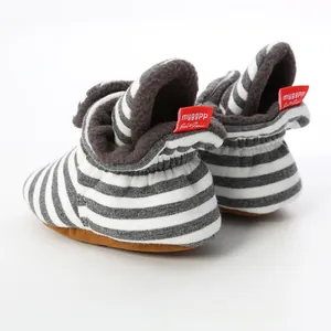 Cozy striped knit baby booties with soft soles and warm fleece lining for 0-1 year olds