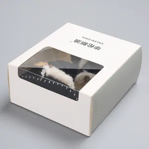 Detail view of baby winter snow boots inside a professional white window gift box