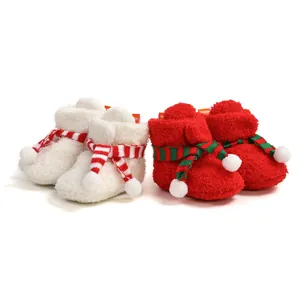 Cozy fleece baby Christmas walking boots featuring festive striped scarf decoration