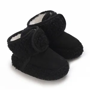 Detail view of cozy black baby winter snow boots featuring a soft fleece lining