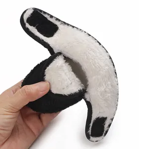 Detailed macro view showing thick white faux fur lining inside black warm baby winter boots