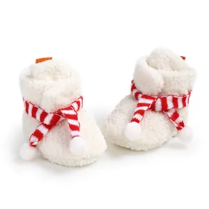 Cozy white baby fleece boots featuring festive red and white striped scarf detail