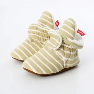Cozy yellow striped knit baby booties with soft plush lining for infants 0-1 year old
