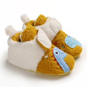 Cozy yellow sherpa baby booties with a cute cartoon dinosaur design for winter warmth