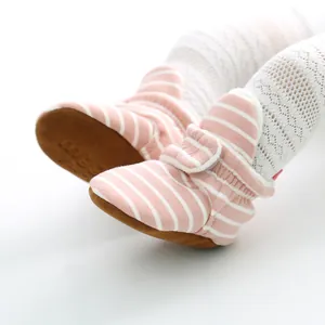 Pink striped knit soft-sole baby shoes for infants aged 0-1, displayed on feet.