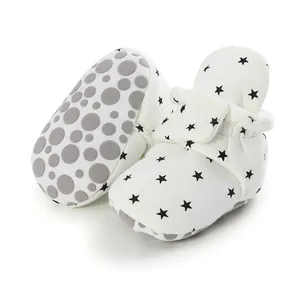 Close-up of baby soft sole walking shoes with black star pattern and non-slip sole