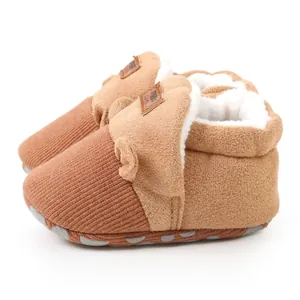 Detailed view of warm plush-lined baby walker shoes with soft knit toe and non-slip sole