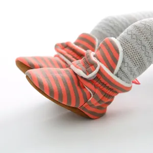 Cozy orange and grey striped knit baby booties with comfortable soft soles for infants.